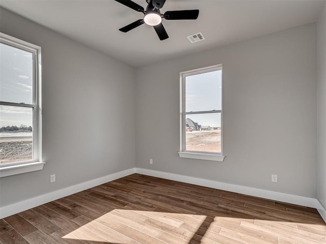 empty room with wood-type flooring and ceiling fan