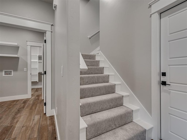 stairs with wood-type flooring