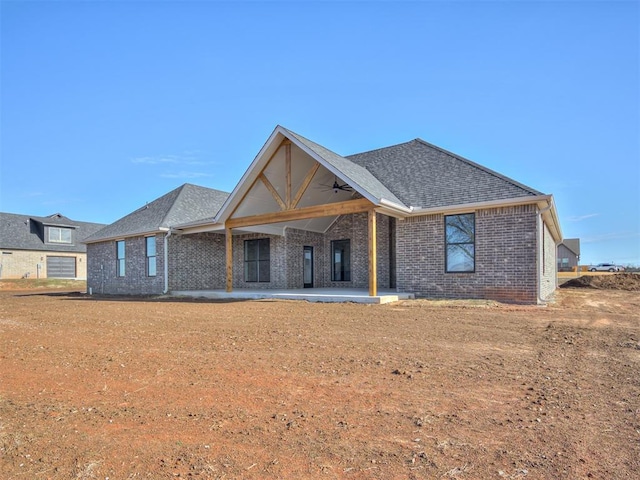 back of house featuring a patio area and ceiling fan