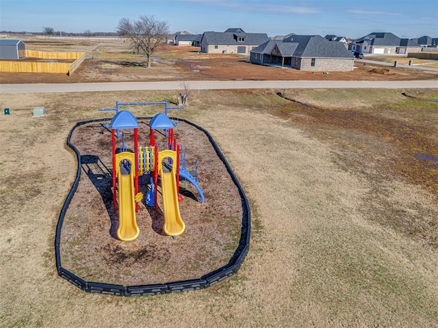 view of home's community featuring a playground