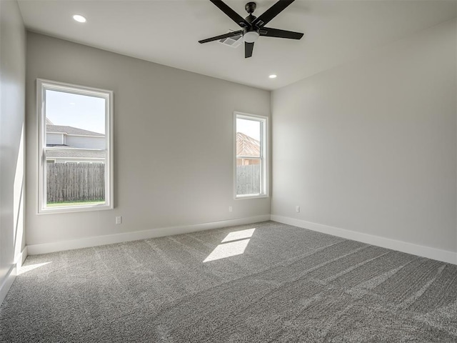 carpeted empty room with ceiling fan