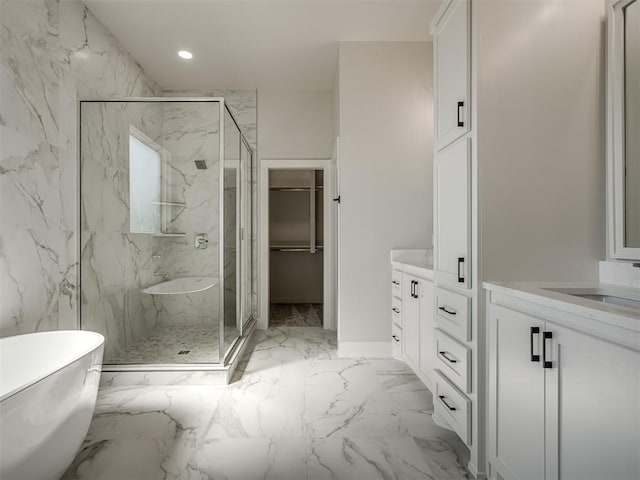 bathroom with vanity and separate shower and tub