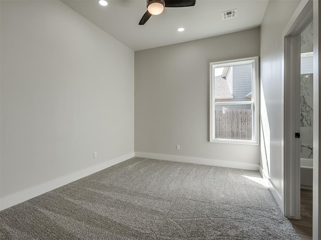 empty room featuring carpet and ceiling fan