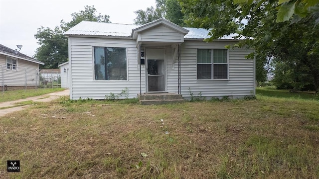 313 W Texas Ave, Anadarko, OK 73005 - bungalow with a front yard and a metal roof