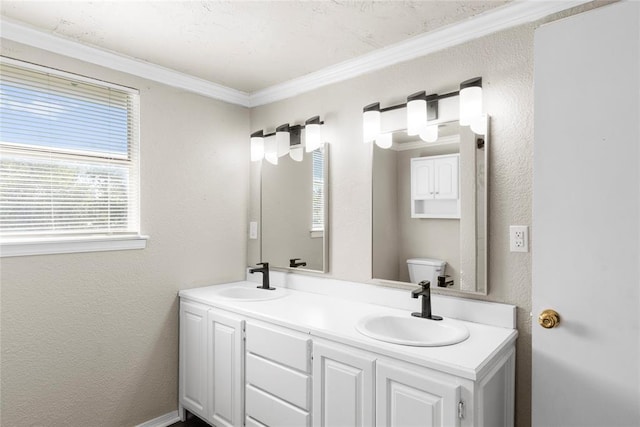 bathroom with crown molding, toilet, and vanity