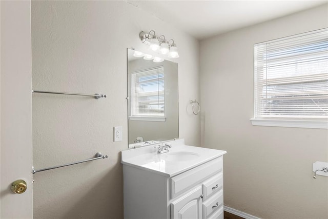 bathroom with vanity and a wealth of natural light