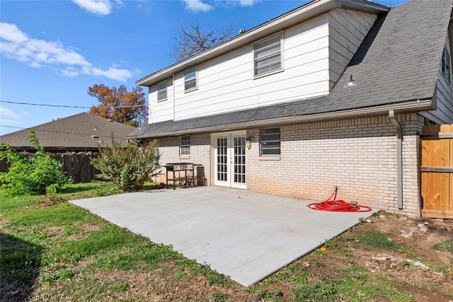 back of property with a patio area and french doors