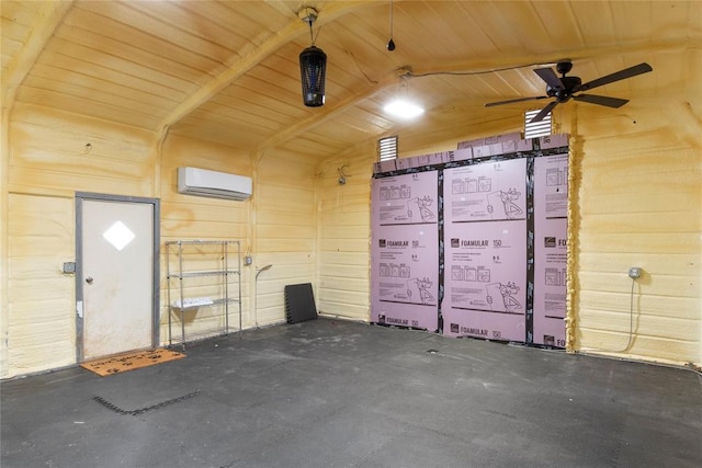 garage featuring ceiling fan and a wall unit AC