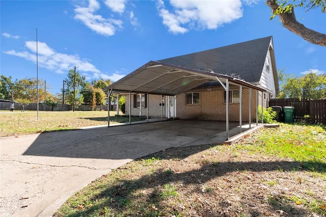 exterior space featuring a yard and a carport