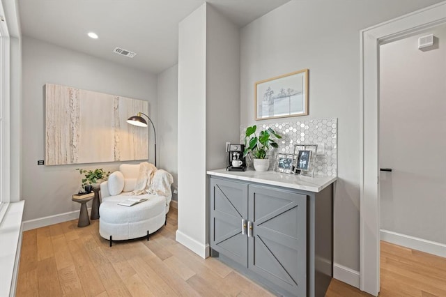 living area with light hardwood / wood-style flooring