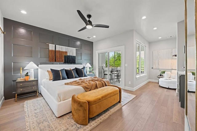 bedroom featuring ceiling fan, light hardwood / wood-style floors, and access to outside