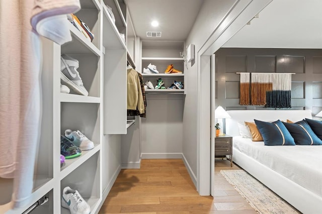 walk in closet featuring light wood-type flooring