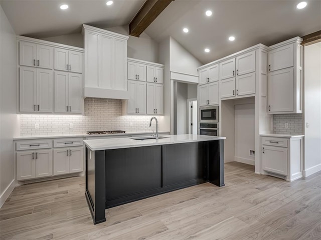 kitchen featuring sink and white cabinets