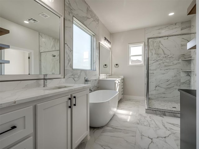 bathroom featuring independent shower and bath and vanity