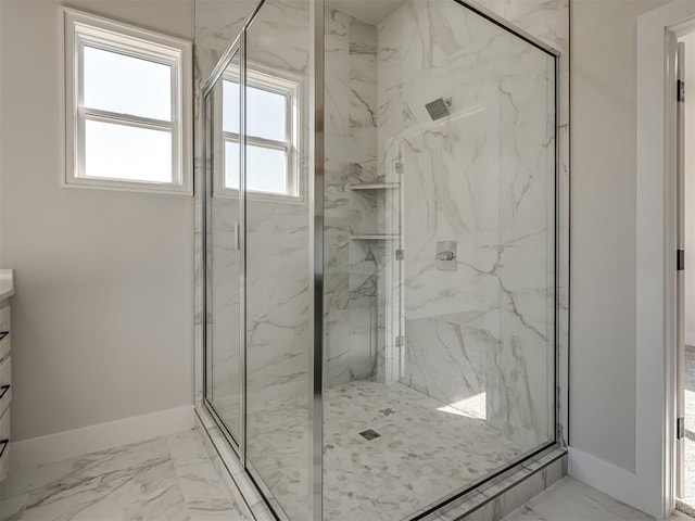 bathroom with vanity and a shower with door