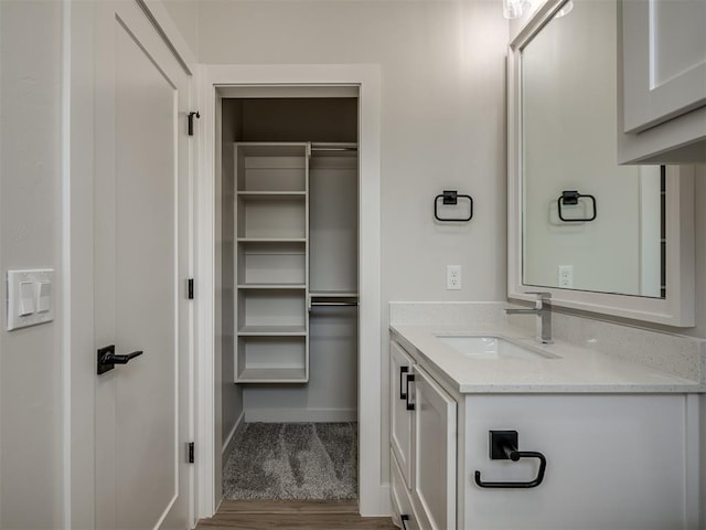 bathroom featuring vanity and hardwood / wood-style flooring