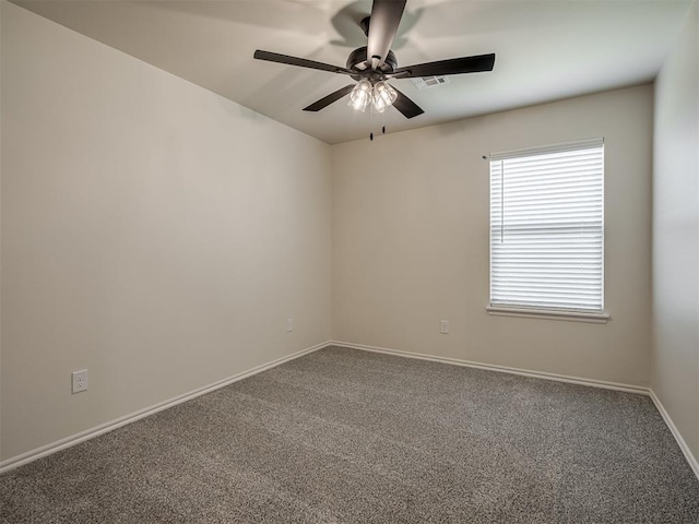 carpeted empty room with ceiling fan