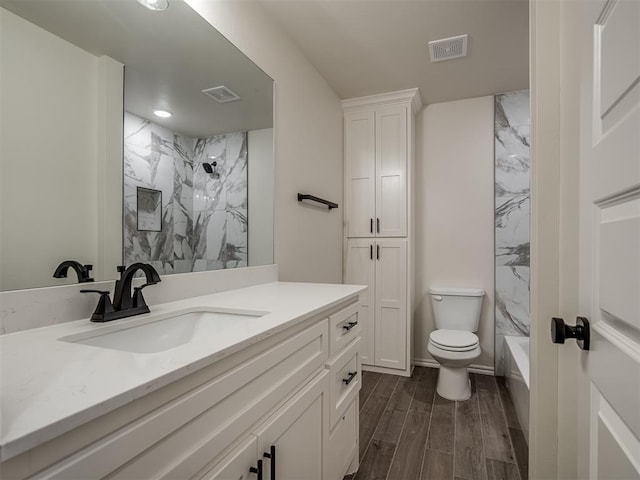 full bathroom featuring vanity, shower / bathtub combination, and toilet