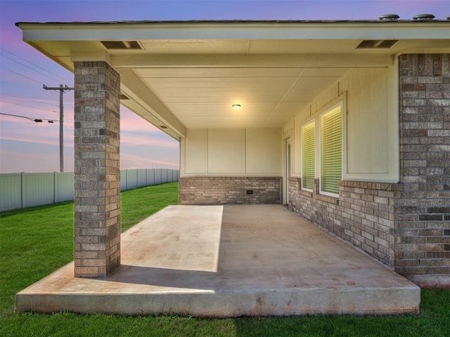 view of patio terrace at dusk