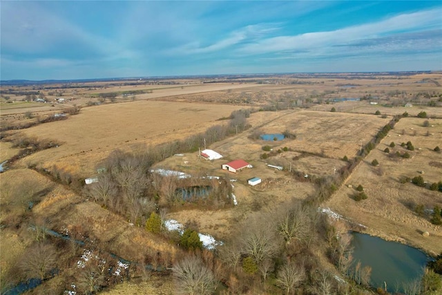 drone / aerial view with a water view and a rural view