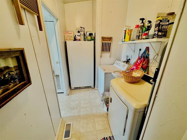 laundry area featuring washing machine and dryer