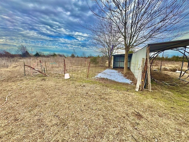 view of yard with a rural view