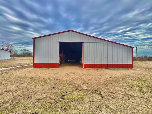 view of outbuilding with a yard