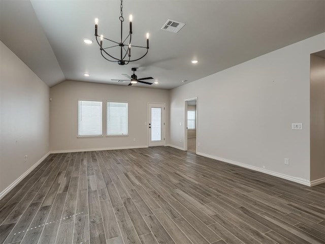 unfurnished living room featuring recessed lighting, wood finished floors, visible vents, baseboards, and ceiling fan with notable chandelier