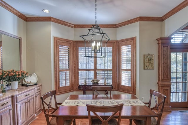 344 Millbrook Dr, Norman, OK 73072 - dining space featuring hardwood / wood-style flooring, ornamental molding, and a notable chandelier