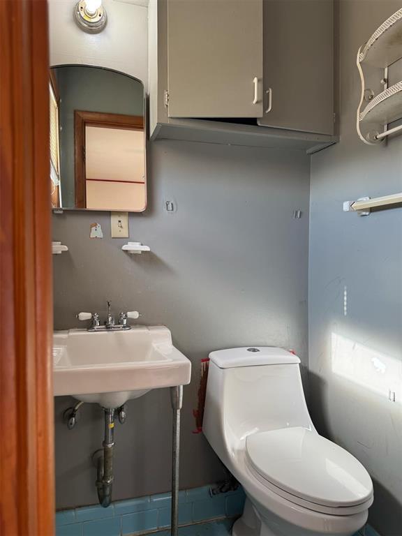 bathroom with sink and toilet