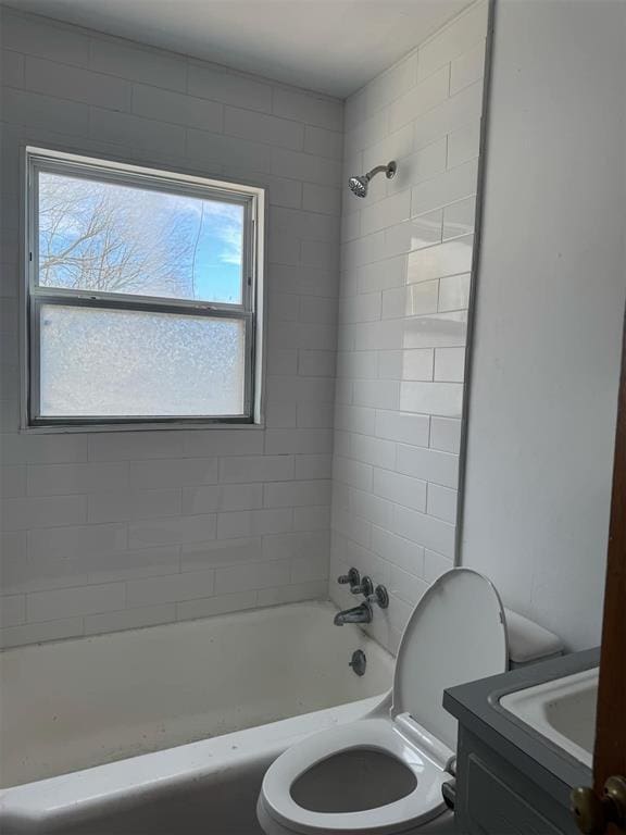 full bathroom with vanity, a wealth of natural light, toilet, and tiled shower / bath