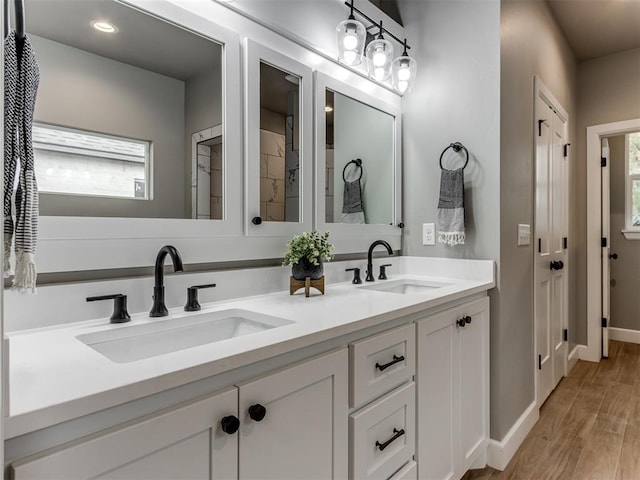 bathroom featuring hardwood / wood-style flooring and vanity