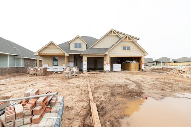 9317 NW 117th St, Yukon, OK 73099 - view of front facade featuring a garage and board and batten siding