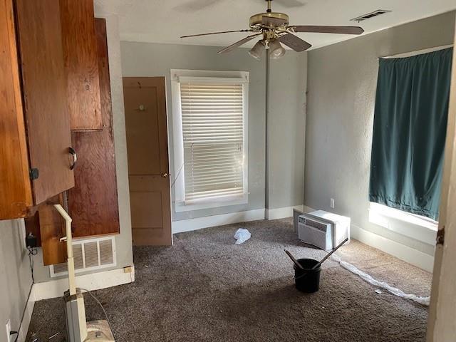 interior space featuring ceiling fan