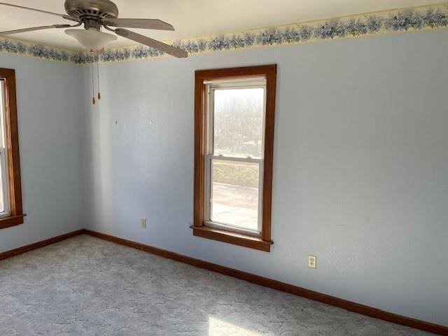 spare room with ceiling fan