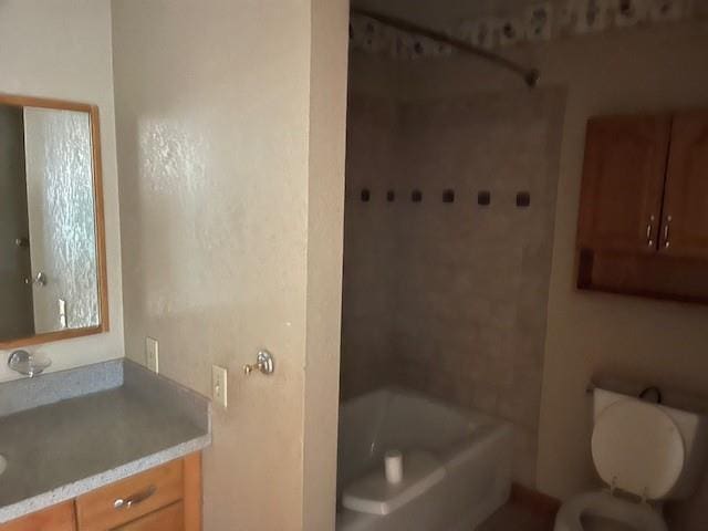 full bathroom with vanity, toilet, and shower / tub combination