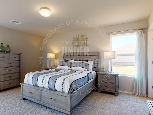 bedroom with light colored carpet