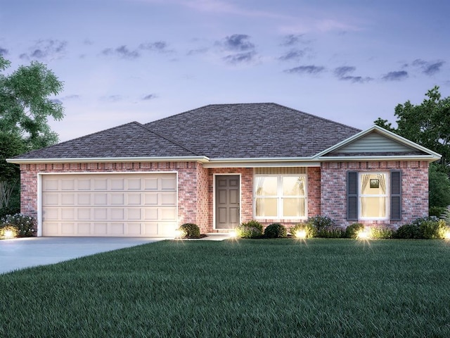 ranch-style house featuring a garage and a front yard