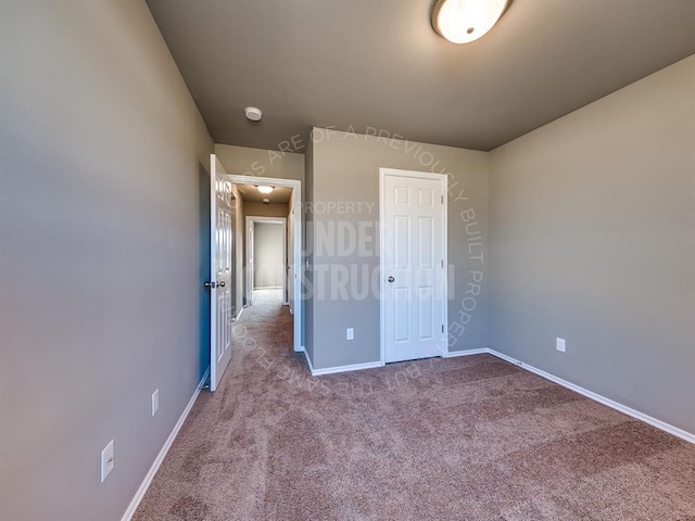 unfurnished bedroom with carpet flooring