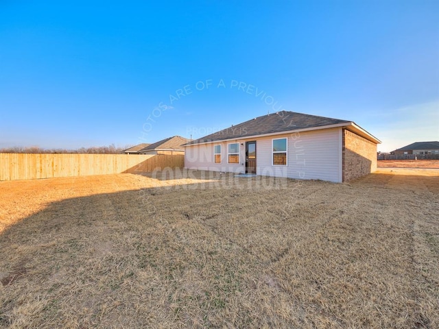 back of house with a yard