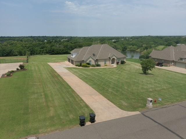 birds eye view of property featuring a wooded view