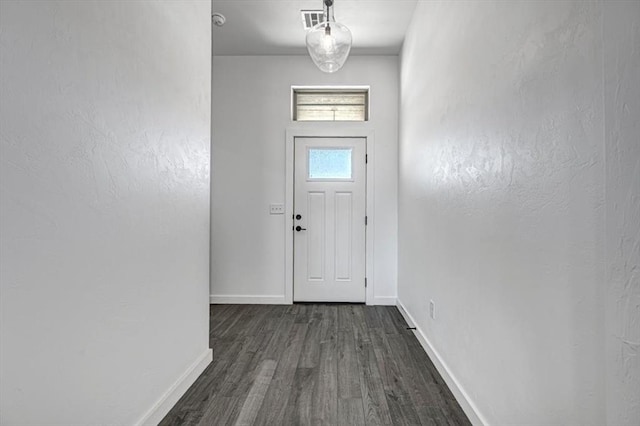 doorway to outside featuring dark hardwood / wood-style floors