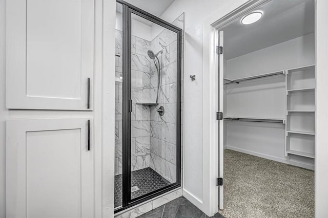 bathroom with a shower with door