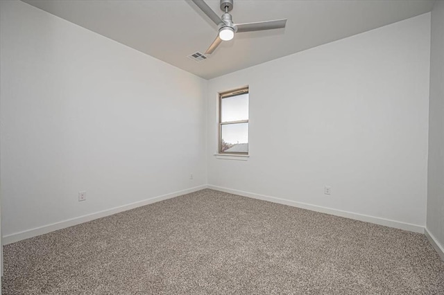 empty room with ceiling fan and carpet flooring