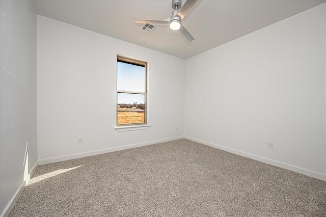 carpeted empty room featuring ceiling fan