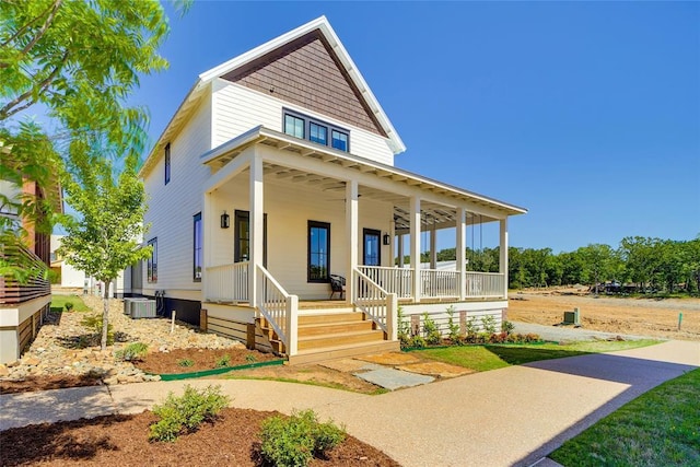 country-style home featuring covered porch and central AC