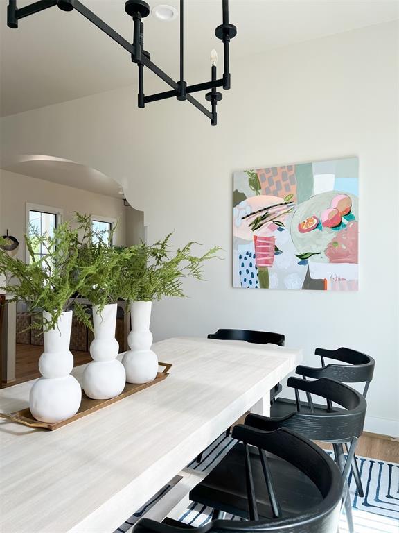 dining space featuring an inviting chandelier and wood-type flooring