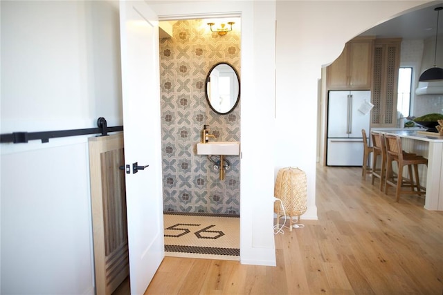 interior space with sink and wood-type flooring