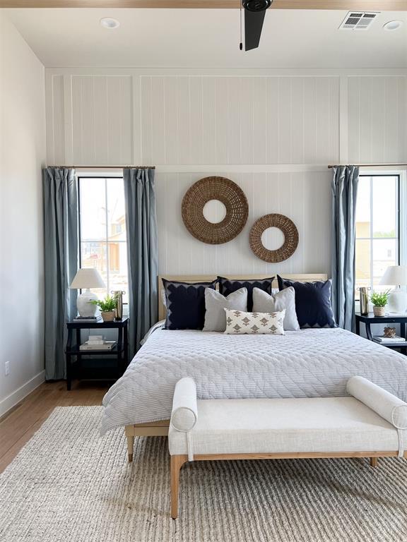 bedroom featuring hardwood / wood-style flooring and ceiling fan