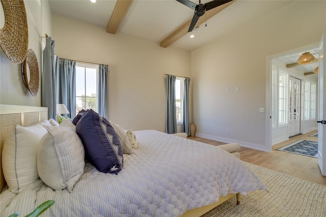 bedroom with light hardwood / wood-style flooring, beam ceiling, and ceiling fan